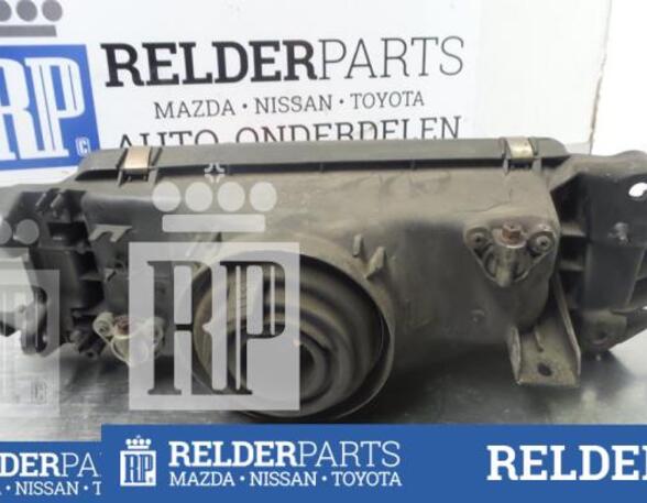 
Scheinwerfer links von einem Mazda 323
